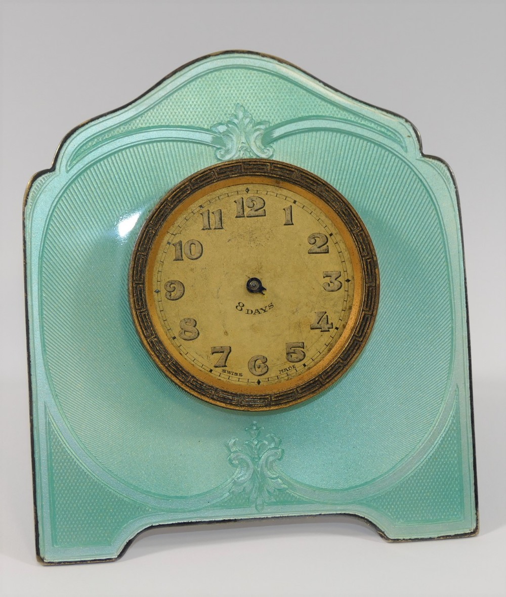 A silver coloured metal and guilloche enamelled easel backed clock,