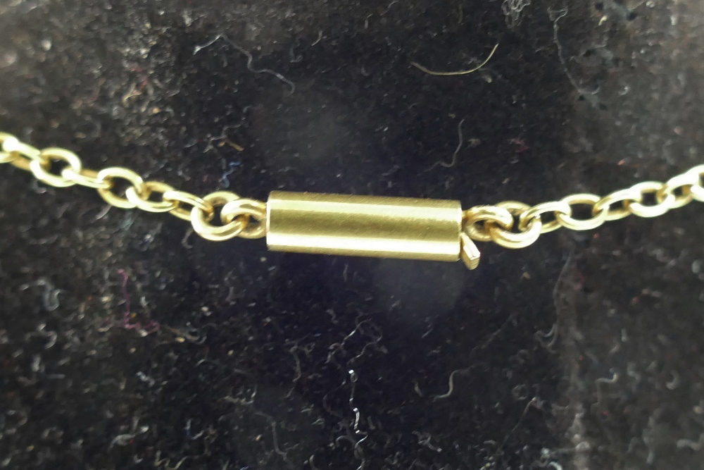 A late 19th/early 20th century yellow metal chain with barrel clasp, - Image 2 of 2