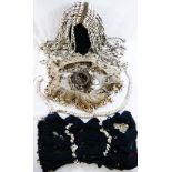 A collection of Cowrie shell decorated tribal items comprised of a headdress, shawl,