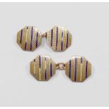 A pair of octagonal engine turned and enamelled yellow metal cuff links stamped '9CT', 5.