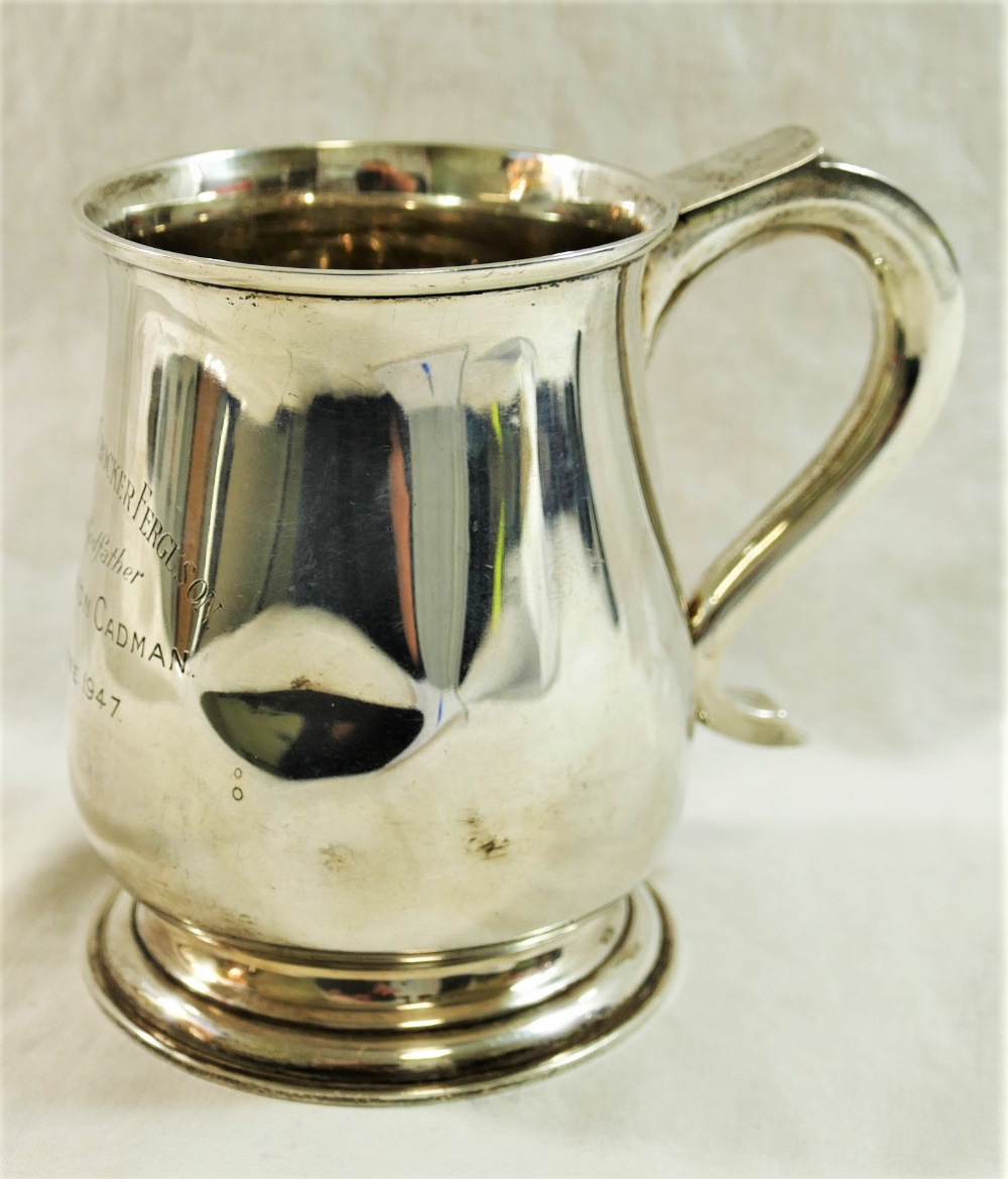 A George VI silver pint tankard with 'S' scroll handle and stepped foot, London 1946,