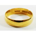 A 22 carat gold wedding band, Birmingham 1962, the shank stamped 'Fidelity', 5mm wide,