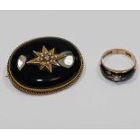 A Victorian 15 carat gold and black onyx set oval mourning brooch, the centre set with gold,