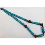 A Native American Navajo turquoise, coral and silver coloured metal bead necklace,