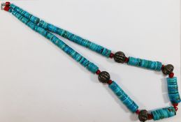 A Native American Navajo turquoise, coral and silver coloured metal bead necklace,