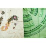 A Christian Dior silk scarf, decorated with a stylised feather and flower petal 'Paris' design,