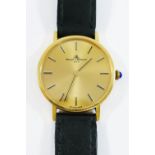 A Baume and Mercier gentleman's wrist watch, in yellow metal case,