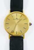 A Baume and Mercier gentleman's wrist watch, in yellow metal case,