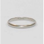A plain platinum wedding band, stamped 'PLATINUM' to the inside of the shank, 2.