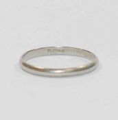 A plain platinum wedding band, stamped 'PLATINUM' to the inside of the shank, 2.