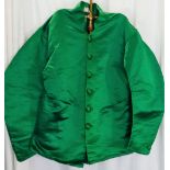 Two early 20th century jockey silk jackets, made by Gilbert Saddlers, Newmarket,