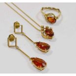A matched suite of heat treated orange citrine and diamond jewellery set in yellow metal stamped