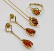 A matched suite of heat treated orange citrine and diamond jewellery set in yellow metal stamped