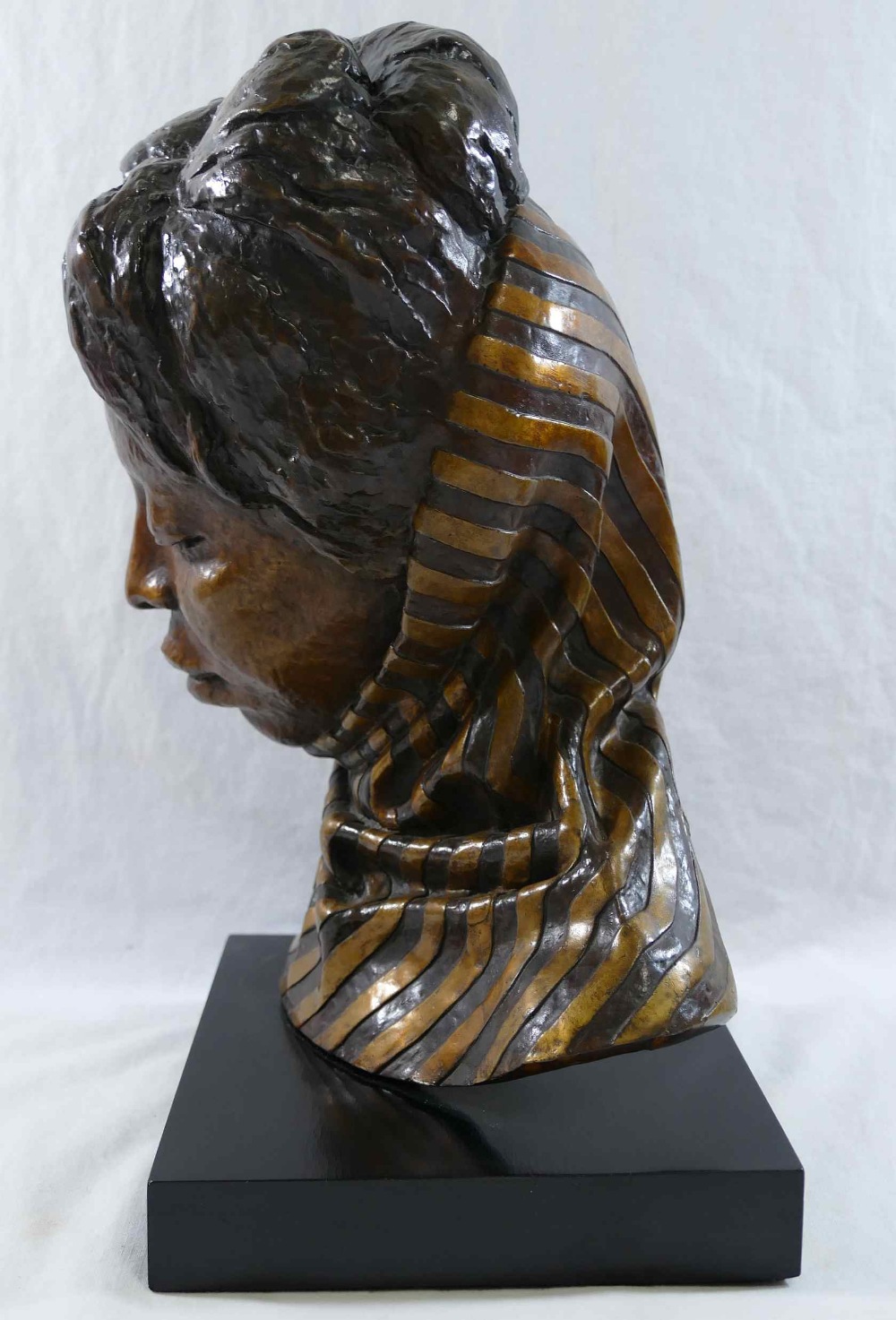 A head study of an African lady wearing a scarf, bronze with gilt detail, on rectangular plinth, - Image 3 of 8