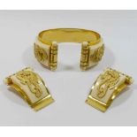 A French Art Deco Jean Painlevè 'Seahorse' cream Galalith and gilt metal cuff and matching dress