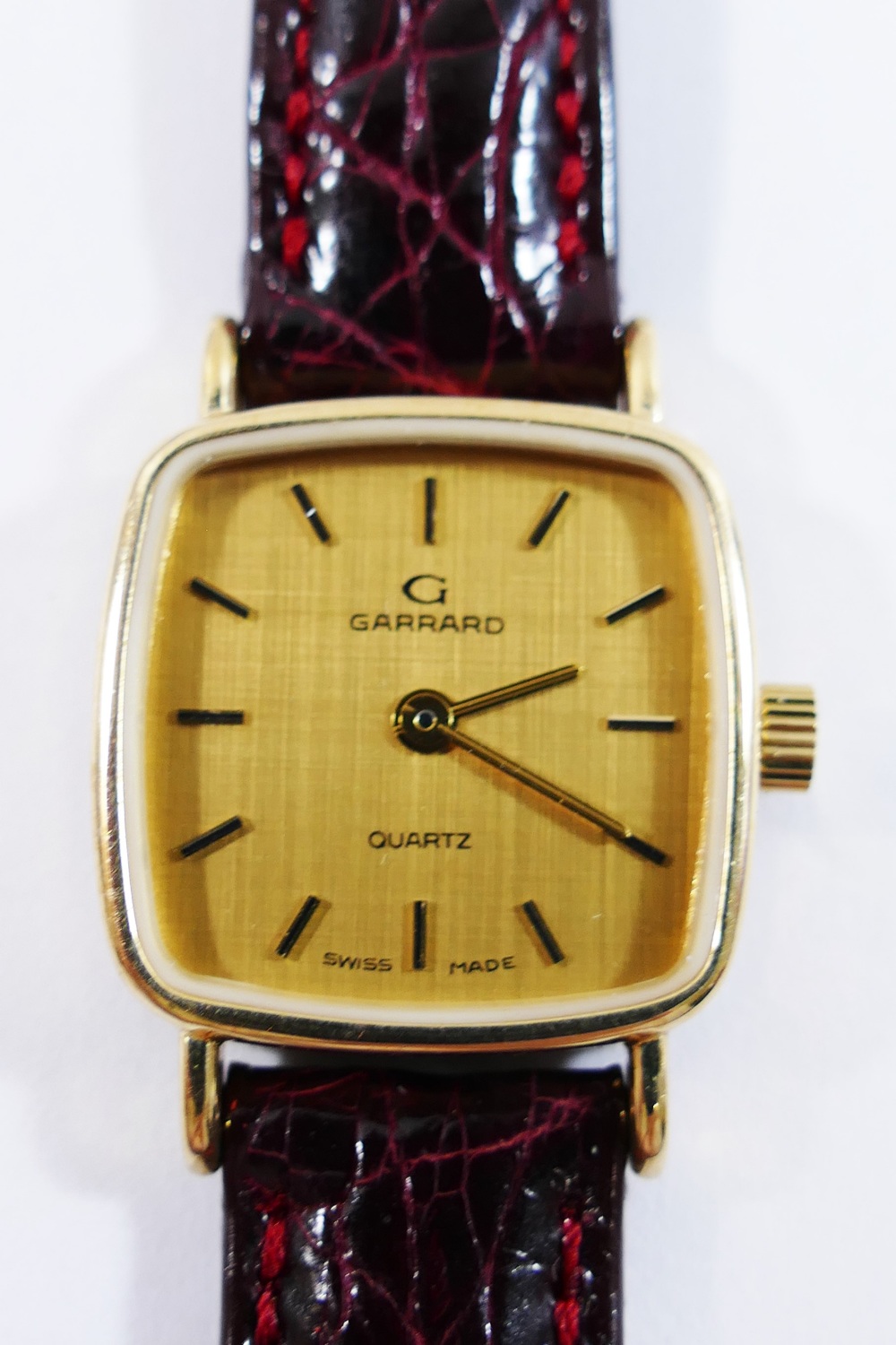 A Garrard ladies wrist watch, housed in yellow metal case,