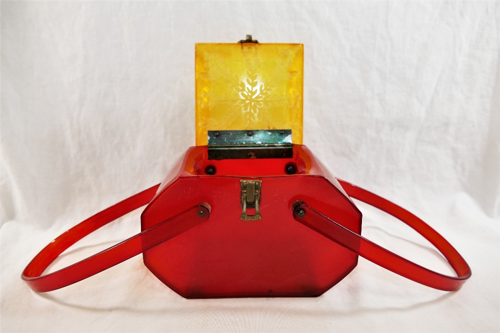 A vintage Lucite handbag, with red body and swing handles and square yellow hinged lid, - Image 2 of 2