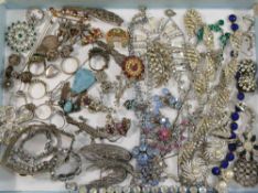 A large quantity of costume jewellery including vintage paste set items, silver, marcasite, ethnic,