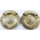 A pair of circular silver ashtrays, Chester 1927, inscribed with the dates 1903-1928, 10.