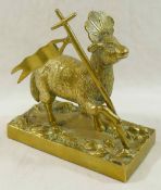 A brass figure of the Lamb of God on rectangular plinth,