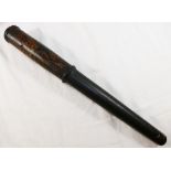 A George III black painted wooden truncheon, of tapered form,