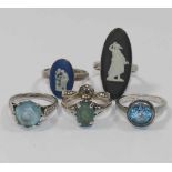 Three blue paste set rings,