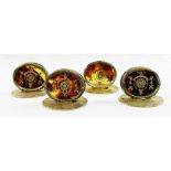 A set of four oval silver and tortoiseshell menu holders, Birmingham 1910 by William Comyns,