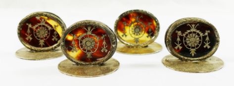 A set of four oval silver and tortoiseshell menu holders, Birmingham 1910 by William Comyns,