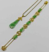 A Chinese carved jadeite and yellow metal bracelet, stamped '14K', 10.