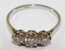 A platinum and diamond three stone ring, the round brilliant cut centre stone approximately 0.