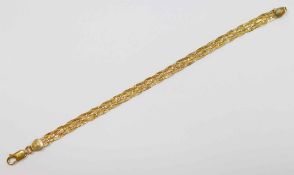 An Italian yellow metal bracelet, in the form of a six strand plait with textured finish,