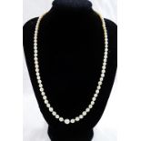 An early 20th century individually knotted graduated cultured pearl necklace with diamond set clasp,