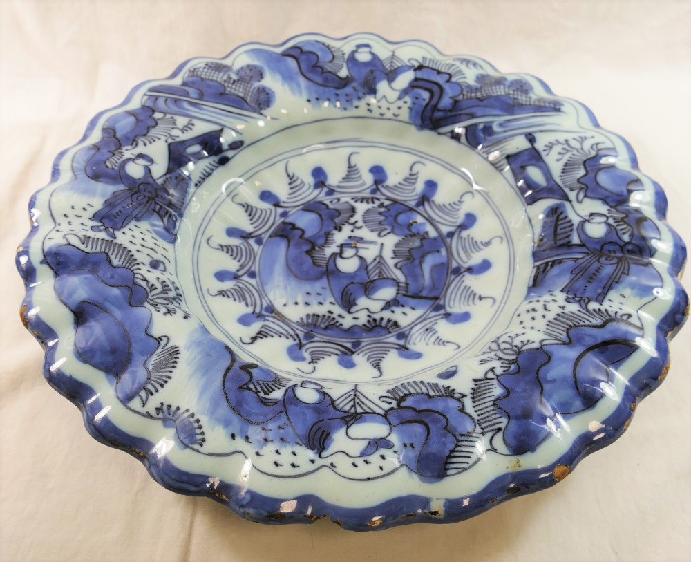 A 19th century Dutch Delft dish, with gadrooned rim,