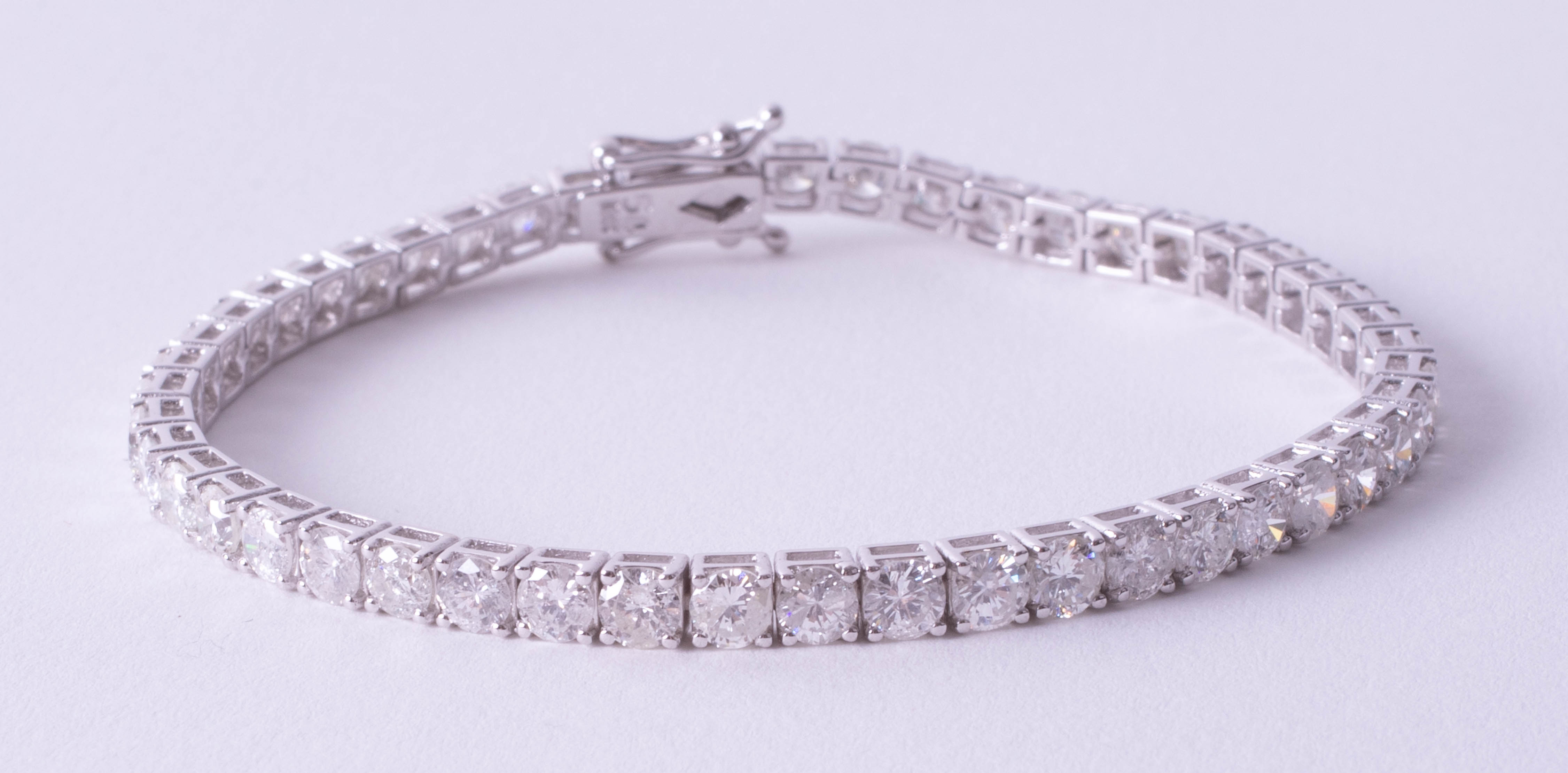 A fine 18ct white gold diamond line bracelet, total diamond weight approximately 8.20ct, set with - Image 2 of 9