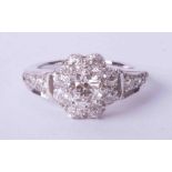 A good 18ct white gold diamond set cluster ring, approx. 1 carat, size M.