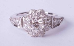 A good 18ct white gold diamond set cluster ring, approx. 1 carat, size M.