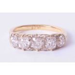 An 18ct Edwardian five stone diamond ring, total weight approx 3 carats, size R.