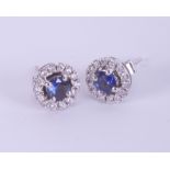 A pair 18ct white gold sapphire and diamond round stud earrings.