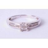 An 18ct diamond set ring, approx. 25 points, size P.