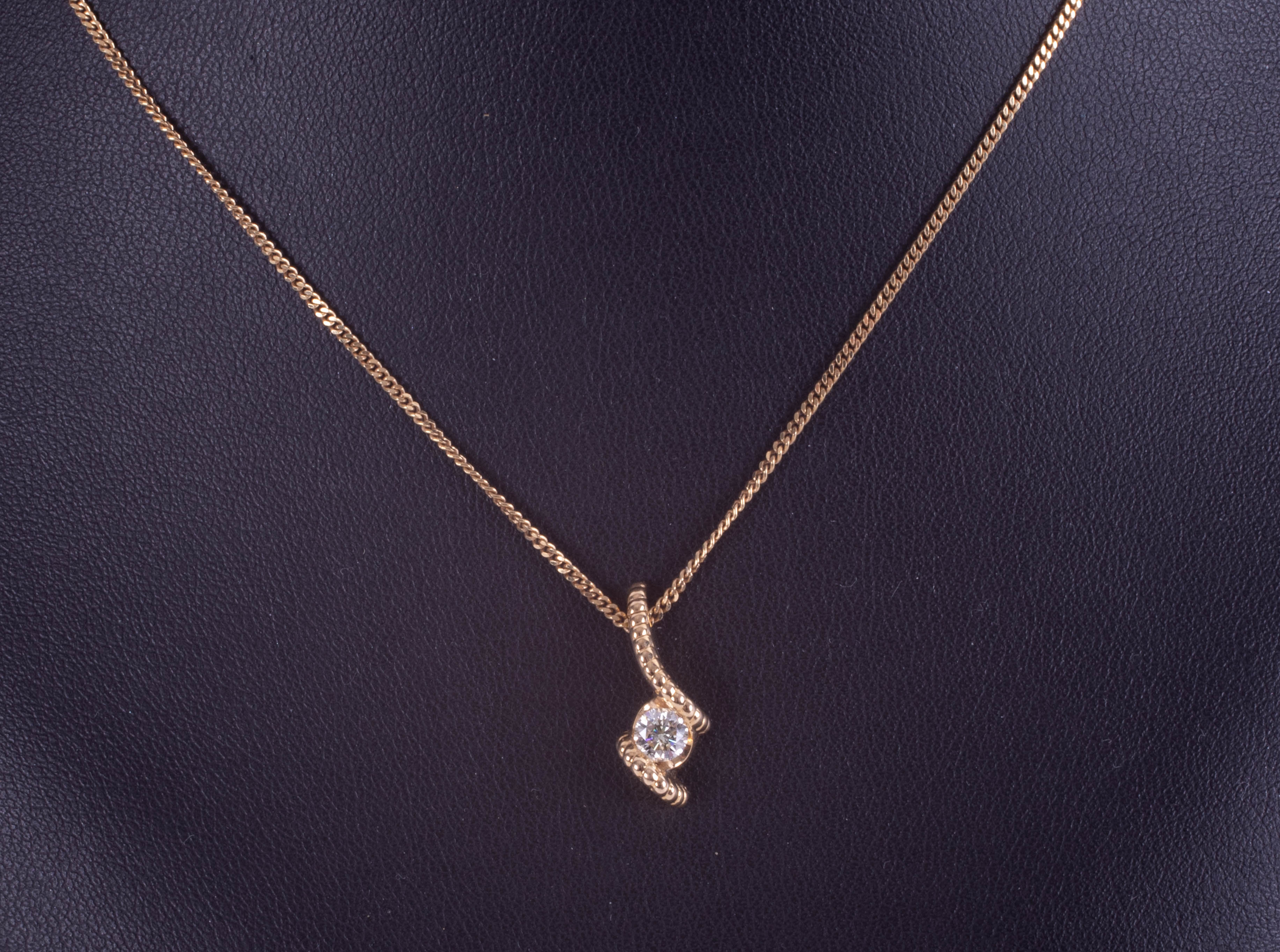 A modern 18ct yellow gold diamond pendant and chain. - Image 2 of 2