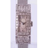 A vintage platinum and diamond cocktail wristwatch.