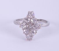 An antique platinum and diamond set marquise shaped ring, size T.
