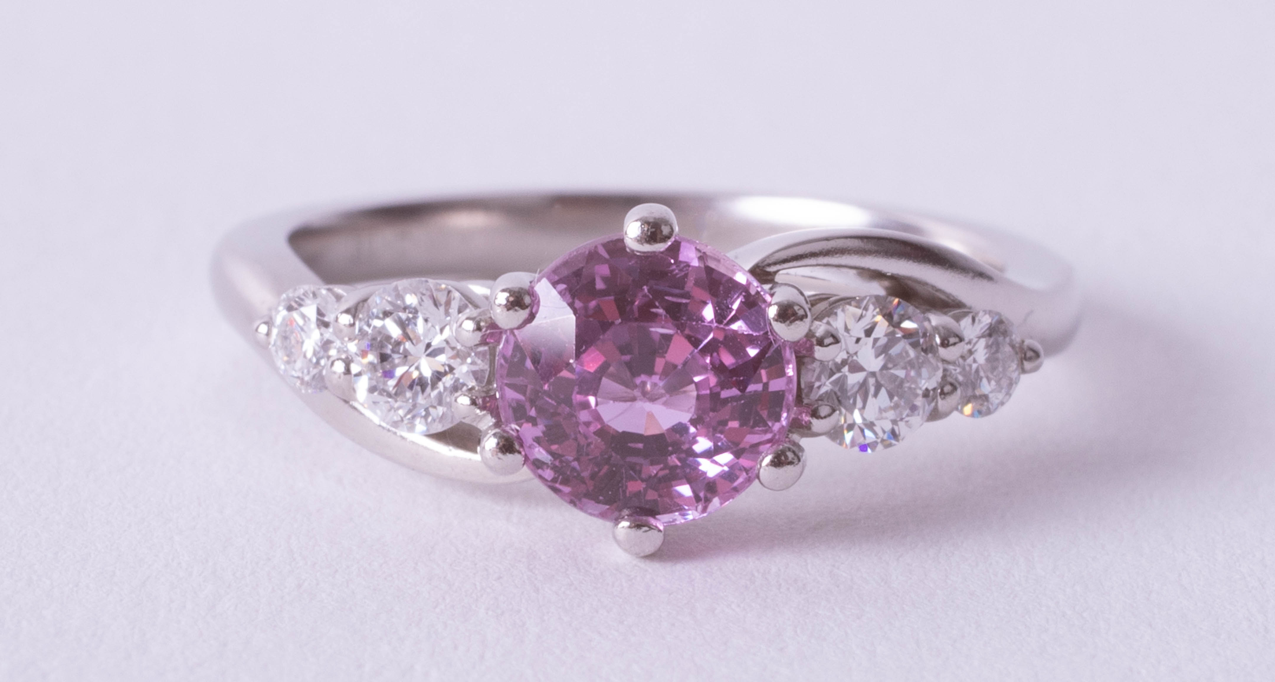 A platinum diamond and pink sapphire ring, size N. - Image 2 of 3