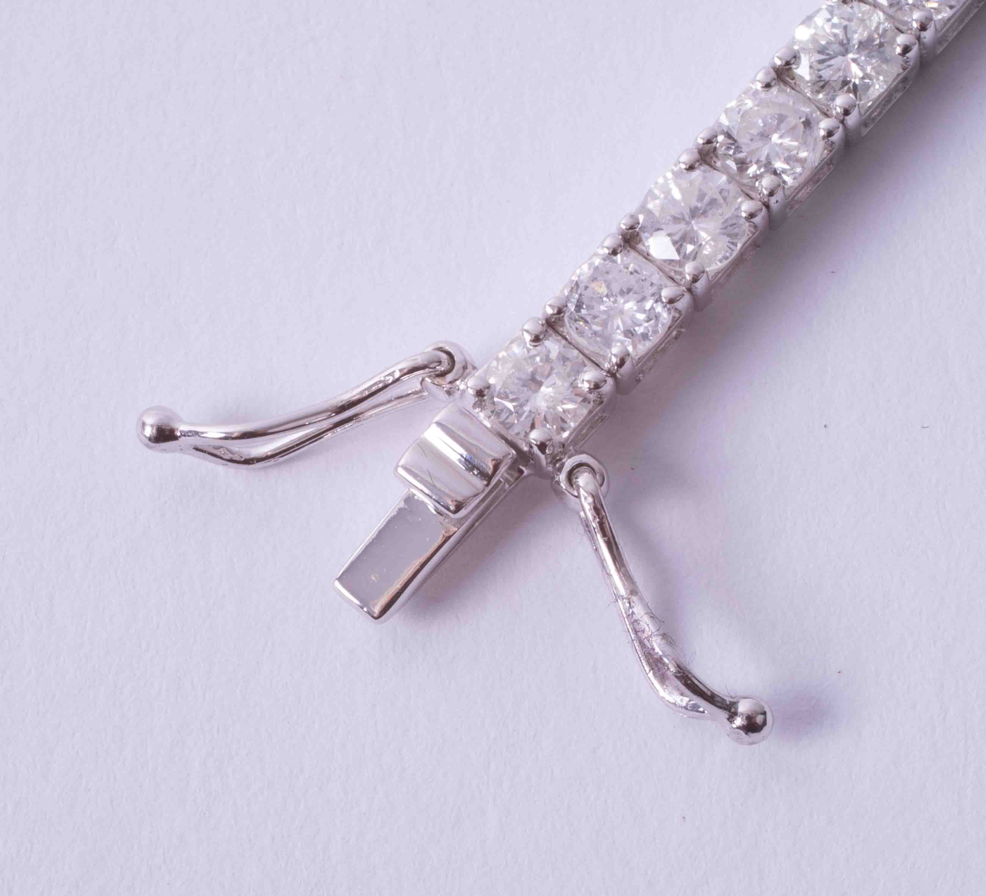 A fine 18ct white gold diamond line bracelet, total diamond weight approximately 8.20ct, set with - Image 6 of 9