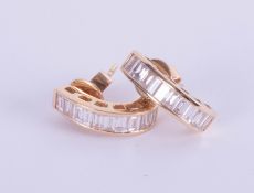 A pair 18ct yellow gold baguette cut diamond half hoop earrings.