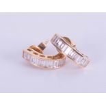 A pair 18ct yellow gold baguette cut diamond half hoop earrings.