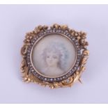 An antique French 18ct yellow gold diamond set portrait brooch.