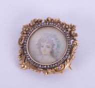 An antique French 18ct yellow gold diamond set portrait brooch.