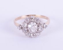 An antique 18ct yellow and white gold diamond cluster ring, size S.