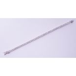 A fine 18ct white gold diamond line bracelet, total diamond weight approximately 8.20ct, set with